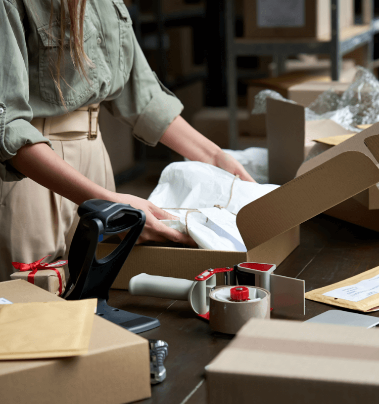 Woman packaging boxes